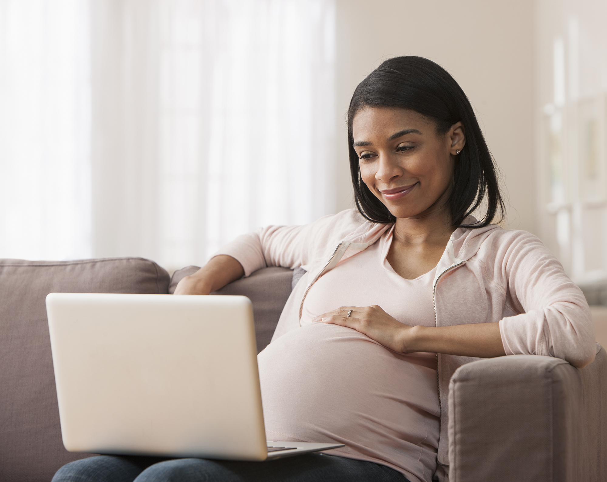 Pregnant woman making online purchase
